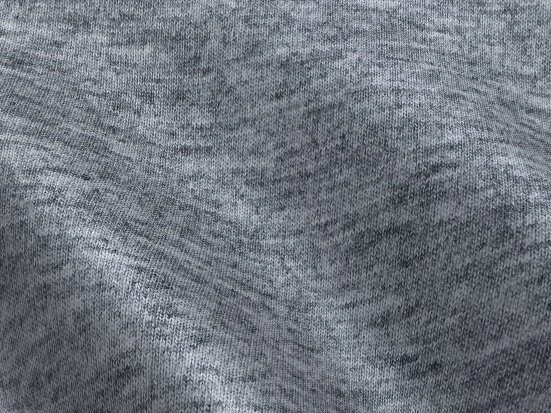 Close up texture of heather grey sustainable knit fabric