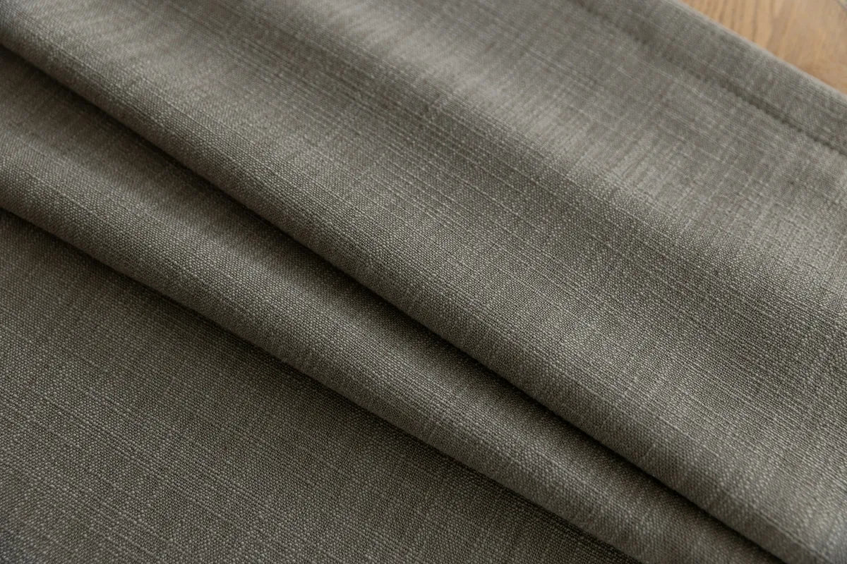Close-up of dark gray fabric with a subtle pattern