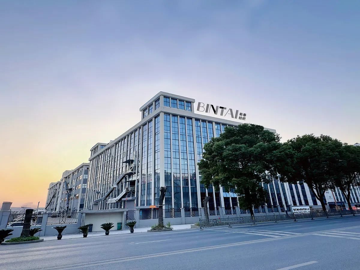 Modern building with 'BINTAL' signage against a clear sky