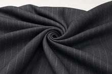 Dark charcoal gray fabric with thin white pinstripes, styled in a spiral drape to show texture and pattern.