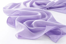 A lavender purple lightweight fabric scarf or sash, elegantly draped with soft folds on a clean white background.