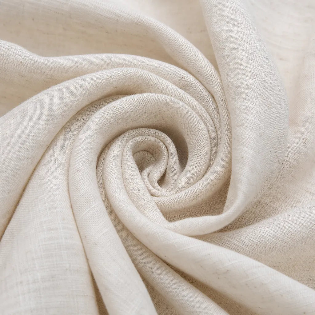 A close-up of a light cream or off-white woven fabric arranged in a spiral drape, showing the texture and fine slub-like weave details.