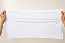 A white rectangular fabric towel or cloth held stretched horizontally by two hands against a plain beige background.