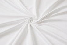 White fabric with a smooth texture, elegantly draped and twisted into a spiral pattern.