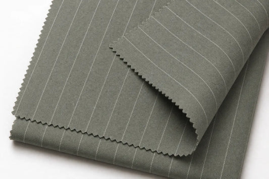 A folded piece of gray fabric with thin white pinstripes, shown on a clean white background.