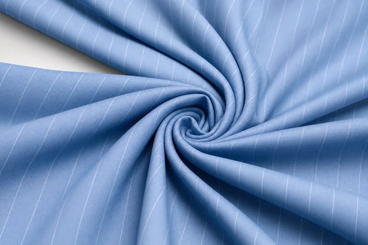 Light blue fabric with thin white pinstripes, arranged in a spiral drape to show texture and pattern.