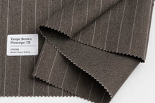 Folded taupe brown pinstripe wool fabric with a white label reading 'Taupe Brown Pinstripe TR 470GSM Woven Heavy Suiting' on a white background.